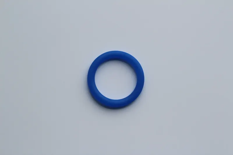 Single blue HNBR O-ring photographed on a plain light background