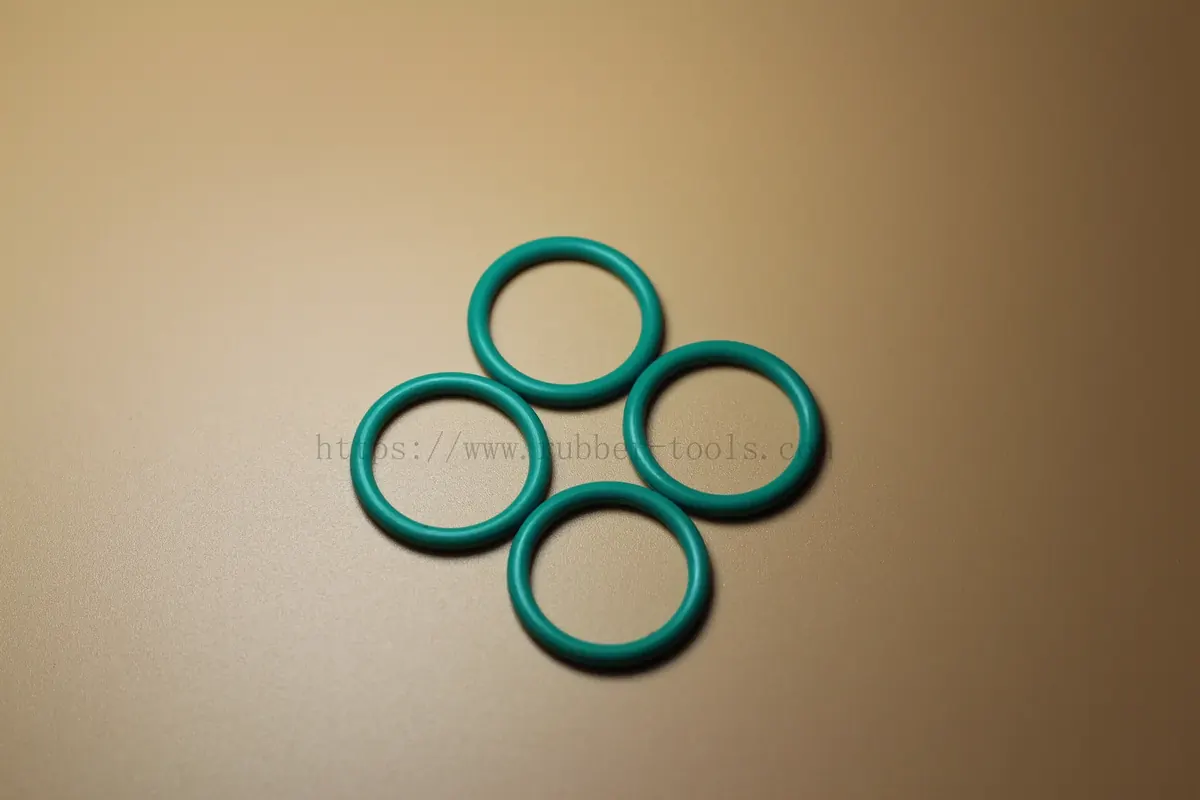 Four teal fluoroelastomer O-rings arranged in a cluster