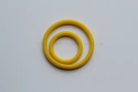 Single yellow O-ring photographed against a plain background