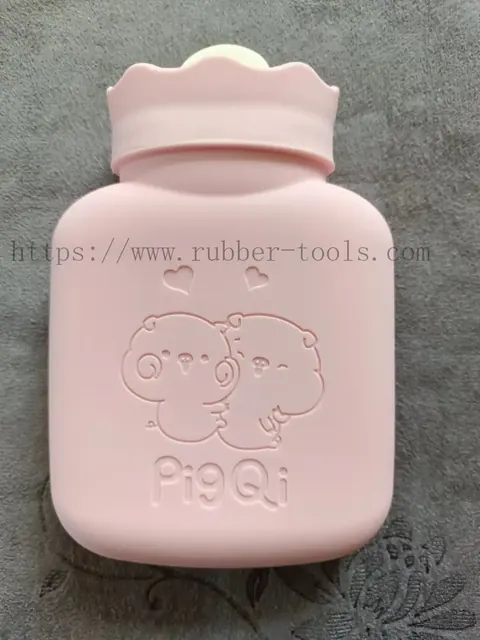 Pink moulded silicone hot water bag with embossed bear pattern and screw cap