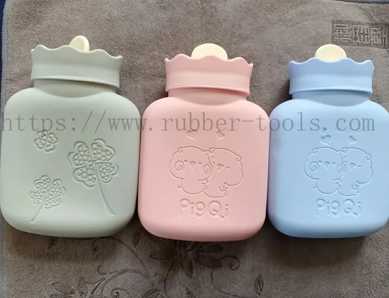 Pink blue and green silicone hot water bags standing side by side