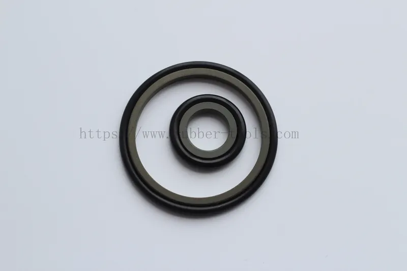 Black moulded sealing ring with a profiled cross section on a light surface